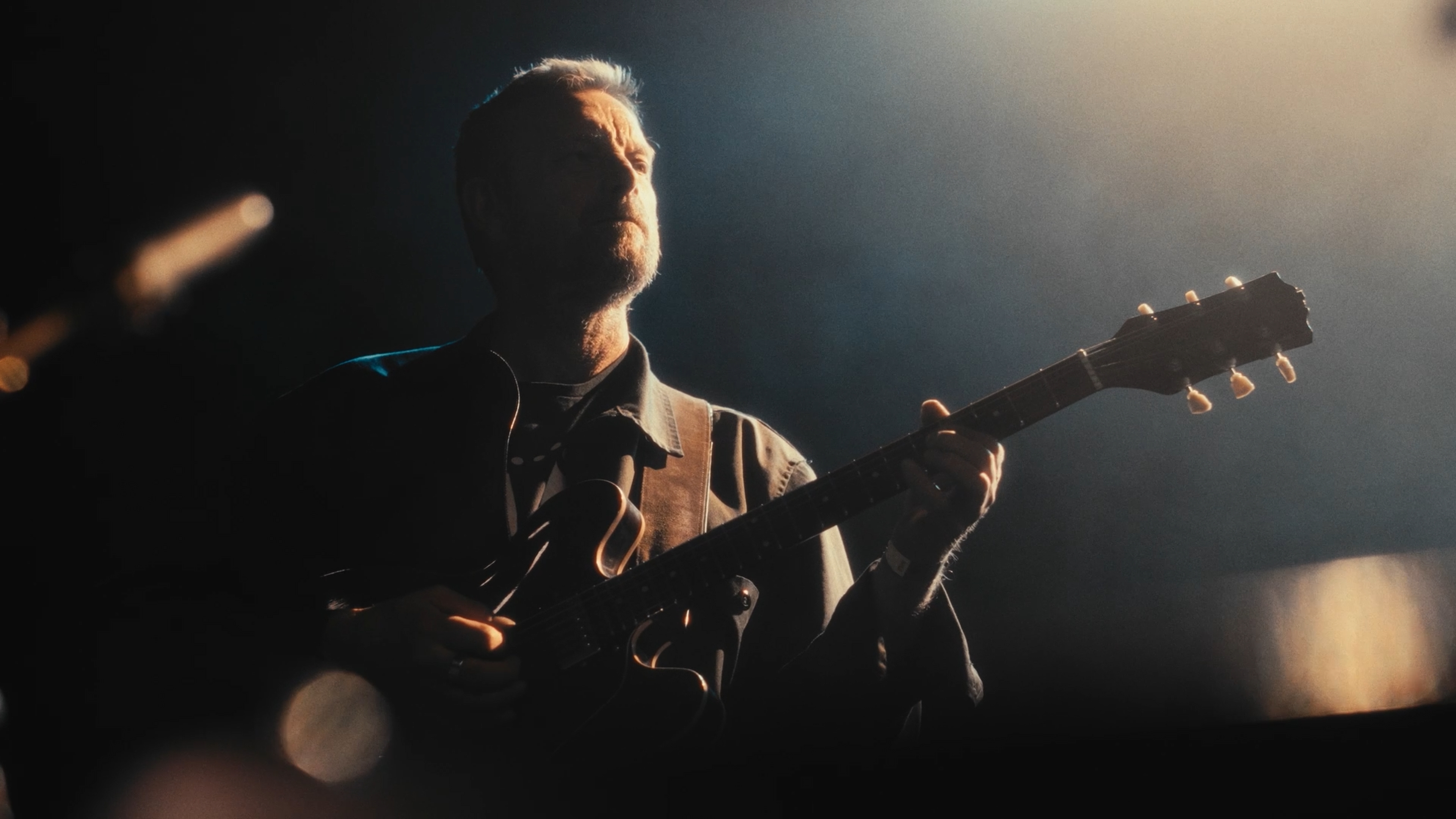 Guitarist in dramatic side lighting