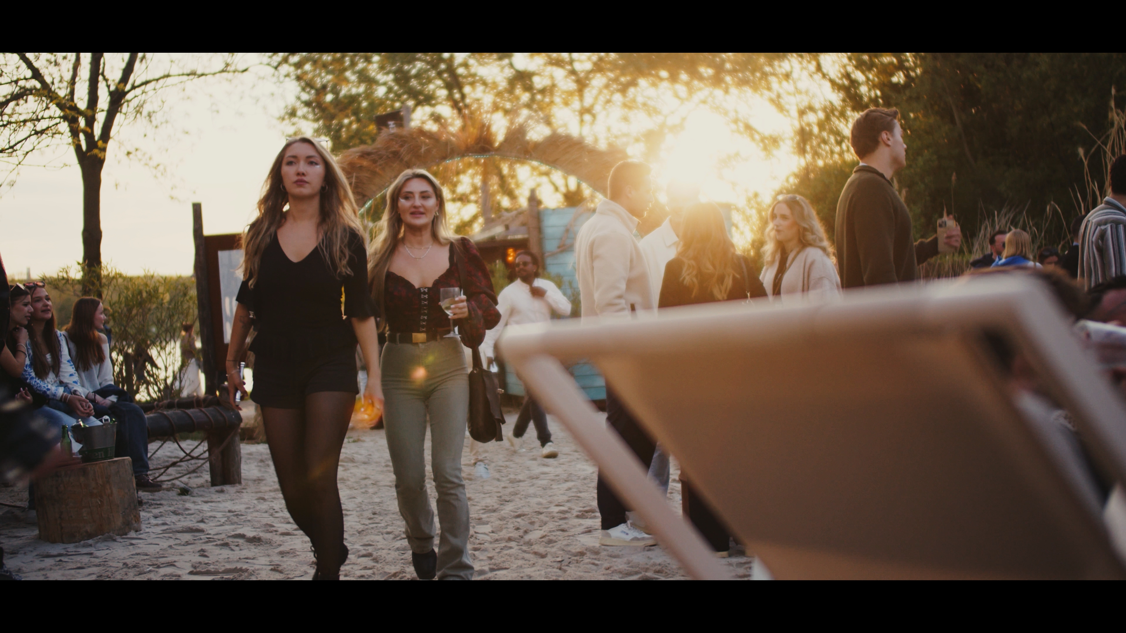 Guests arriving at Bikini Beach in the evening sun