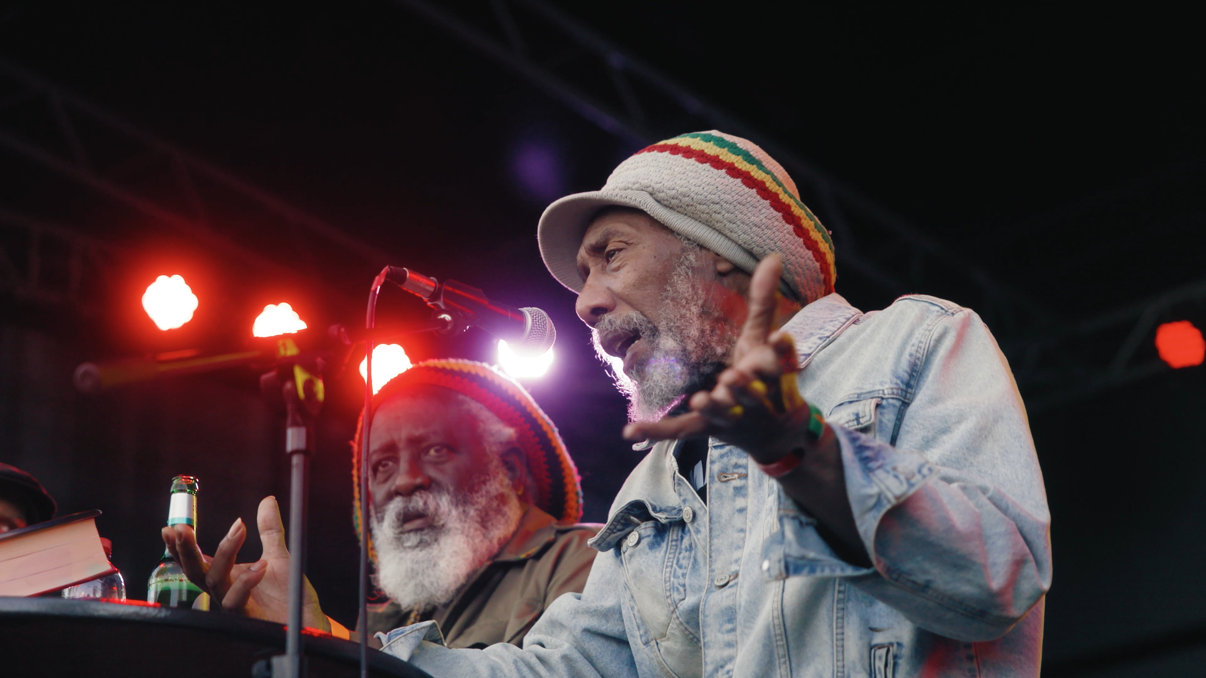Two festival guests sharing a moment in front of the stage